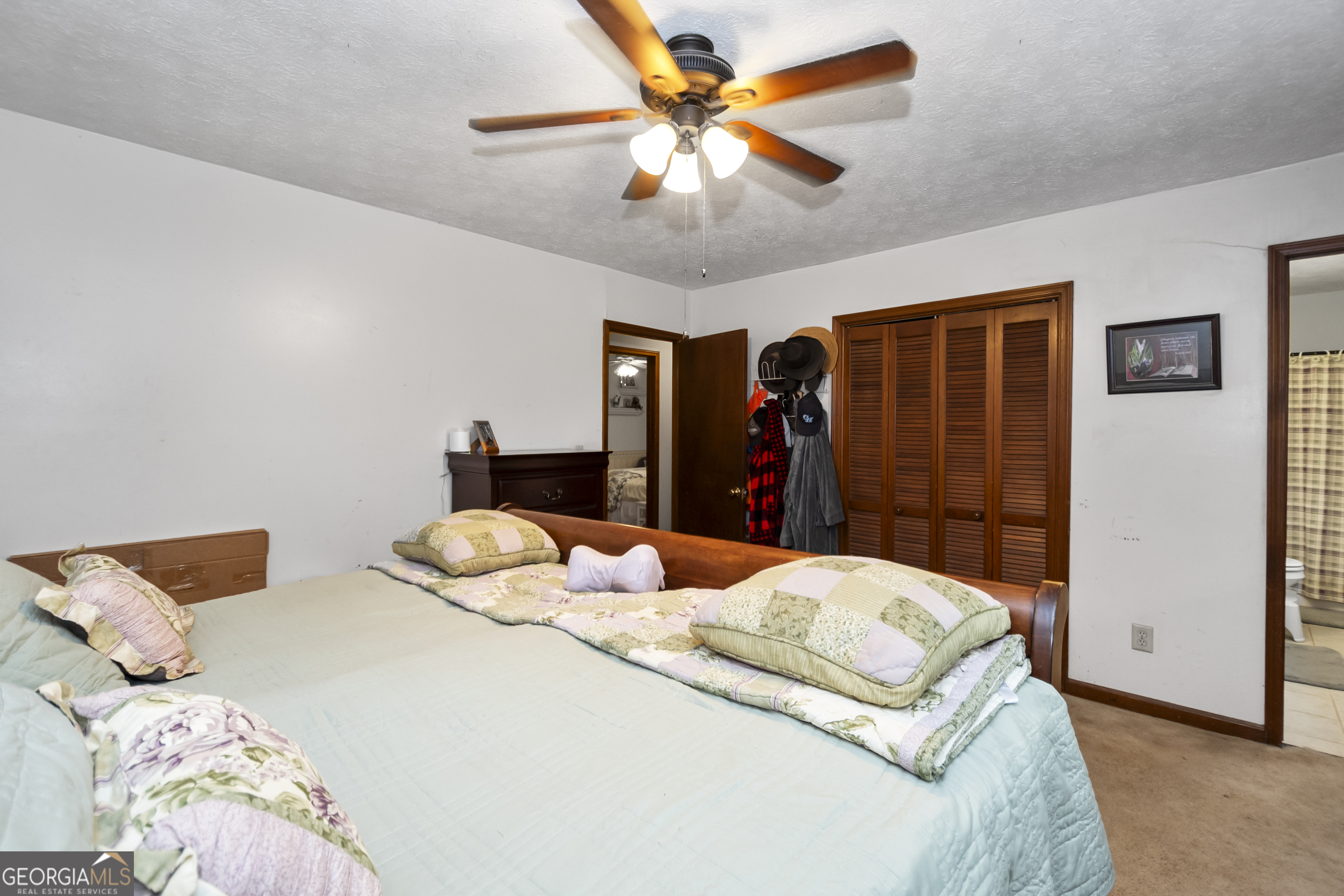 1972 Cox Drive Austell, GA 30168 - Photo 17 of 40 a bedroom with two bed and a chandelier