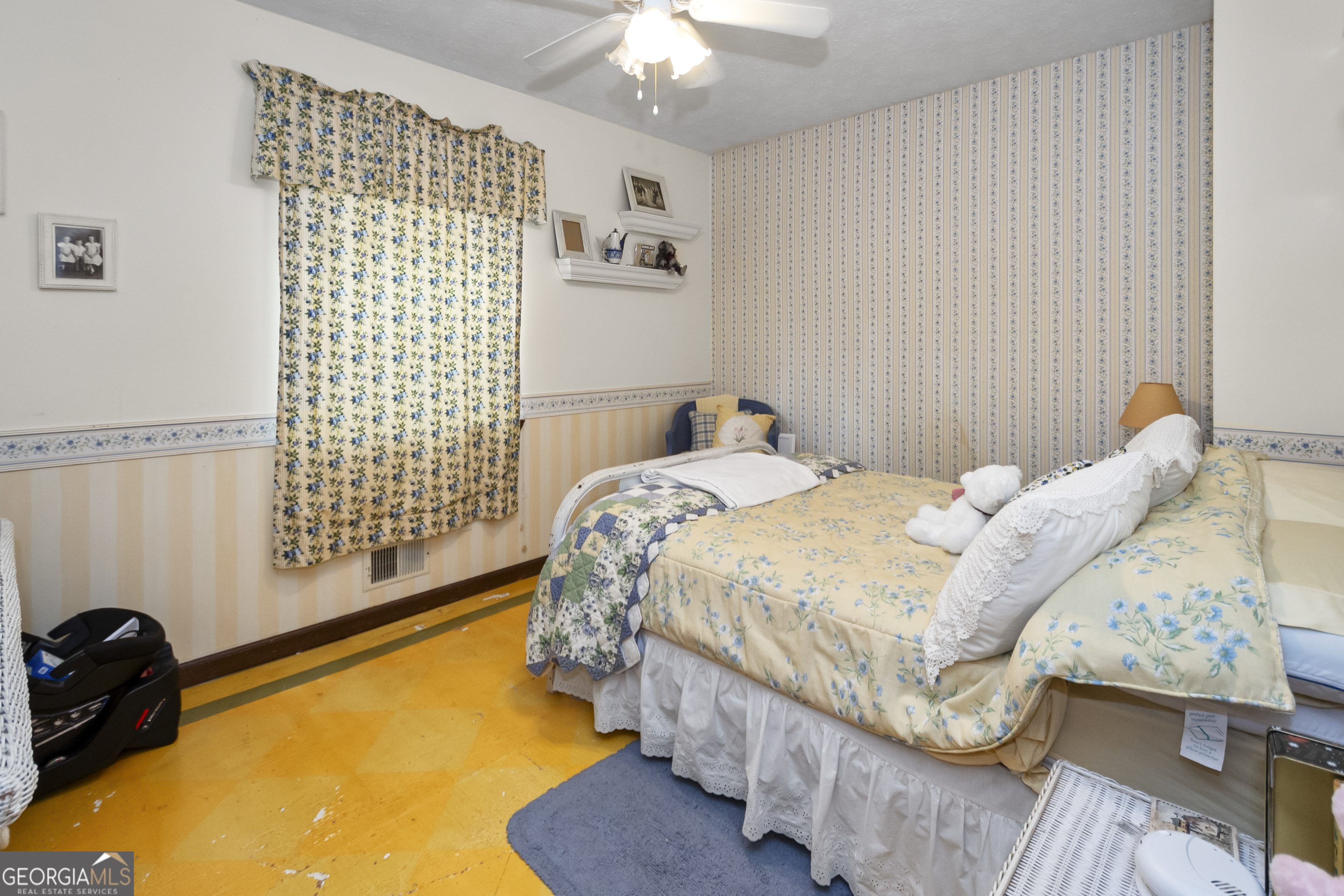 1972 Cox Drive Austell, GA 30168 - Photo 21 of 40 a bedroom with a bed and a chandelier