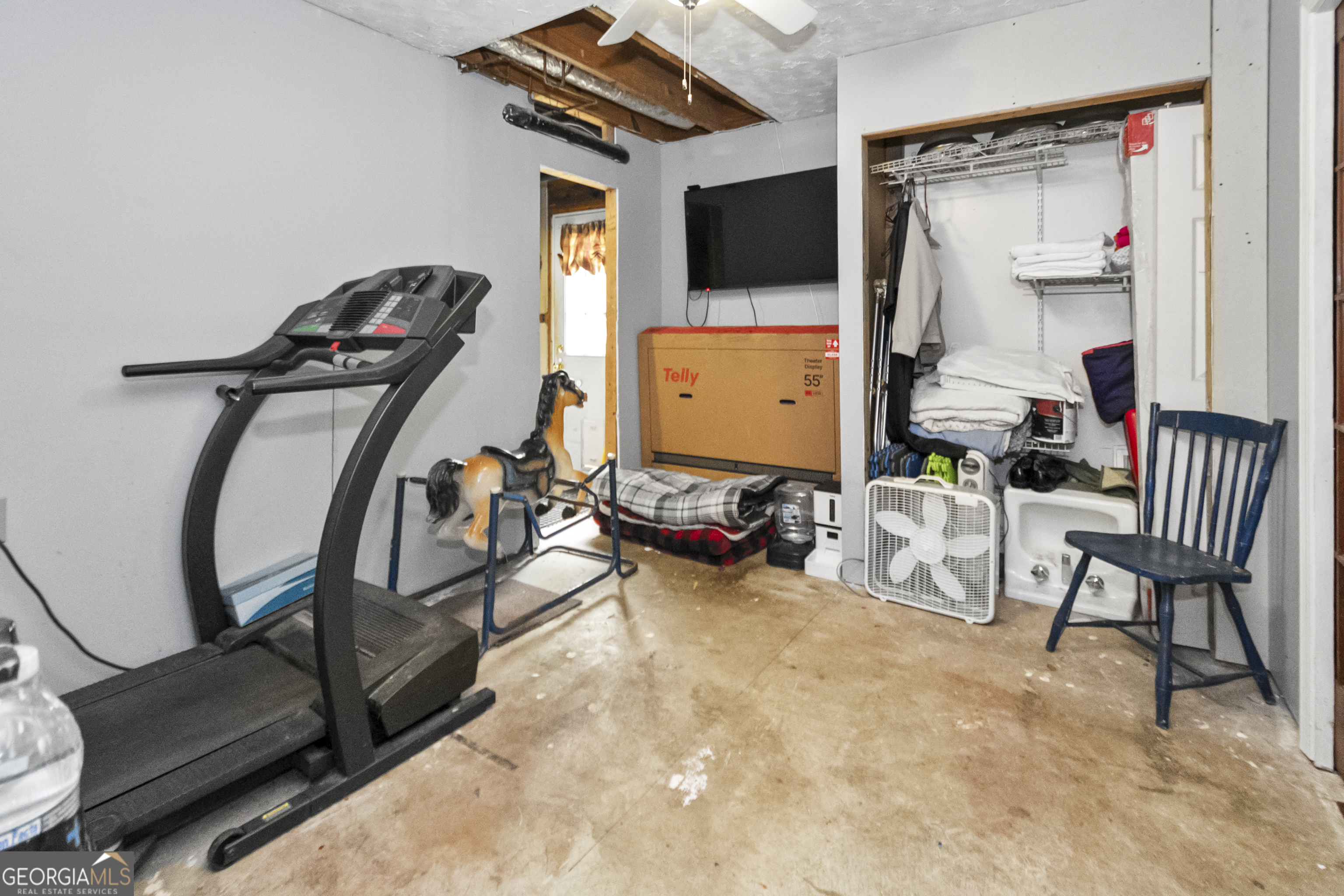 1972 Cox Drive Austell, GA 30168 - Photo 27 of 40 a view of a workspace with furniture and a flat screen tv