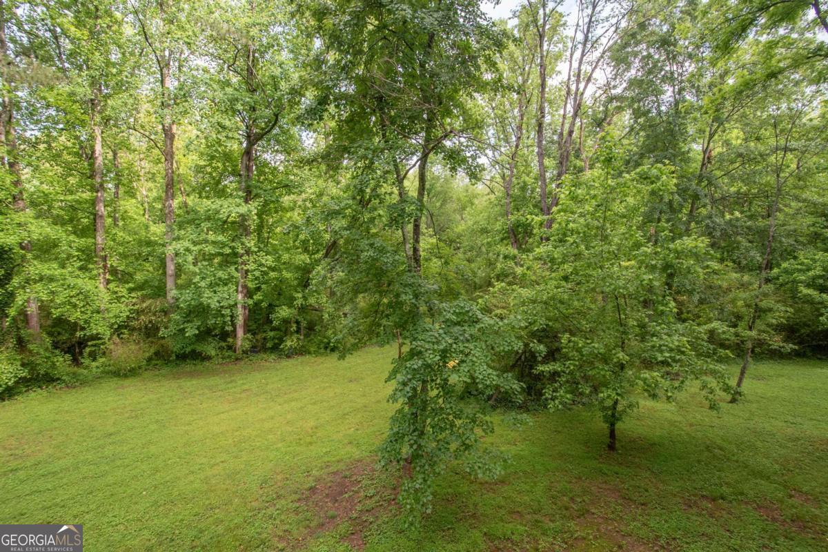 1972 Cox Drive Austell, GA 30168 - Photo 35 of 40 a backyard of a house with lots of trees