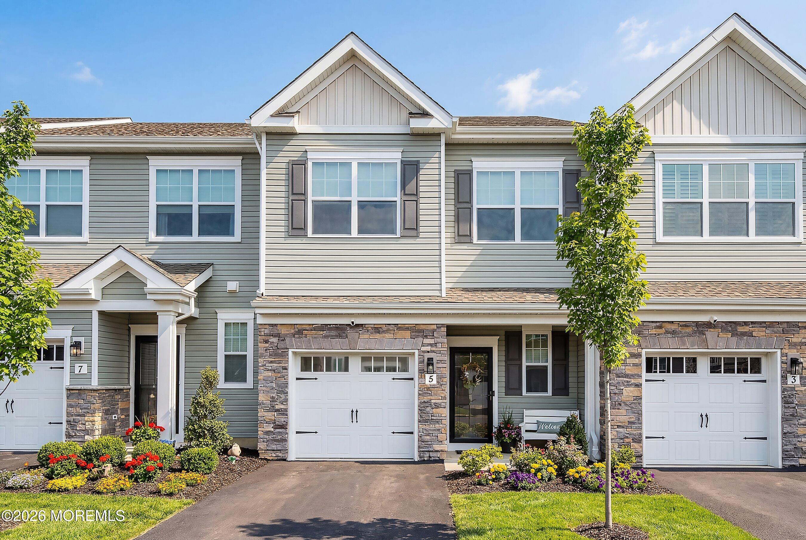 a front view of a house with garden