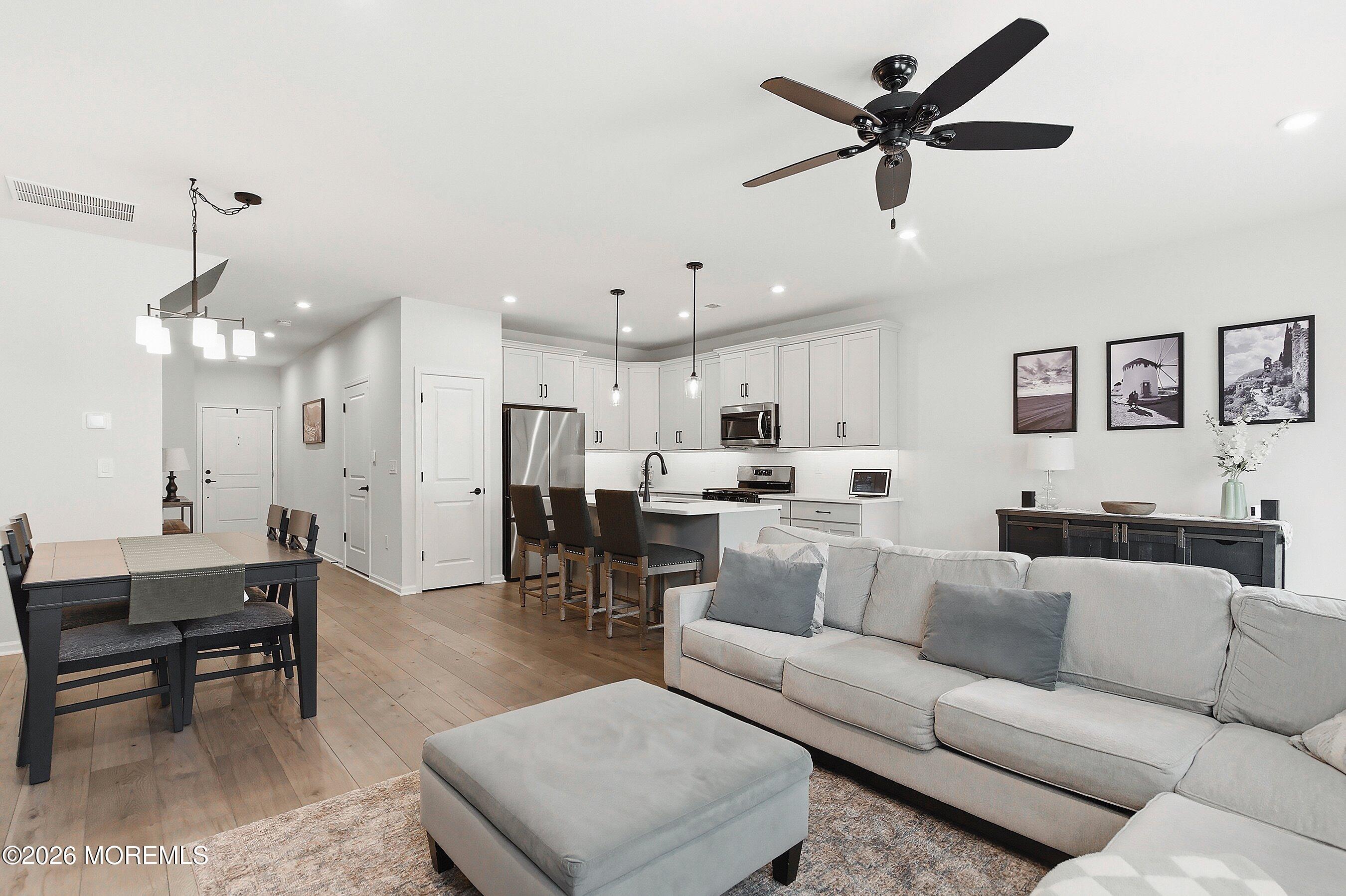 5 Laird Way Neptune, NJ 07753 - Photo 13 of 35 a living room with furniture kitchen view and a chandelier
