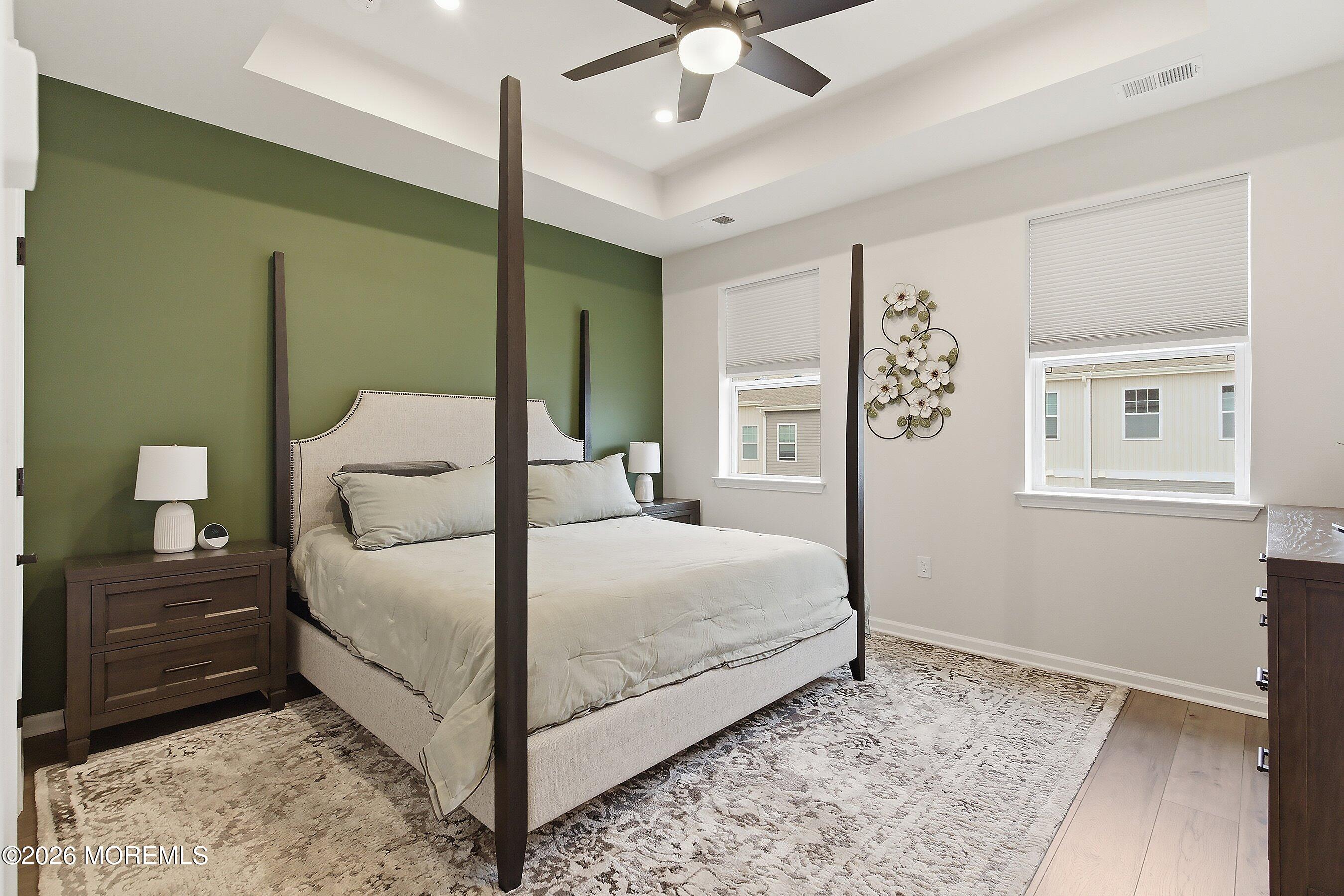 5 Laird Way Neptune, NJ 07753 - Photo 16 of 35 a bedroom with a large bed and a chandelier