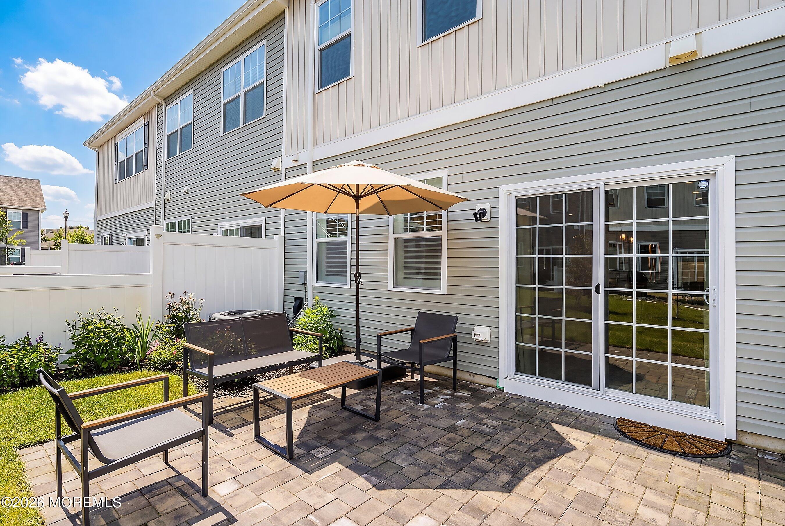 5 Laird Way Neptune, NJ 07753 - Photo 25 of 35 a backyard of a house with table and chairs