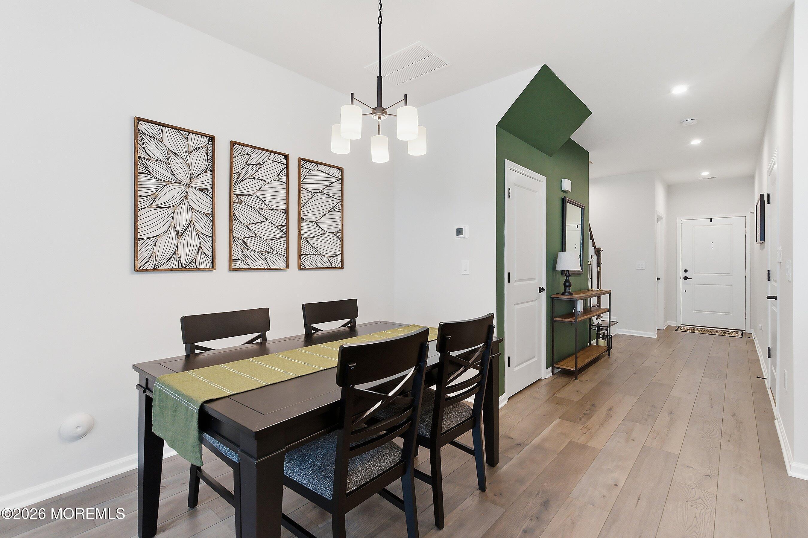 5 Laird Way Neptune, NJ 07753 - Photo 5 of 35 a view of a dining room with furniture and wooden floor
