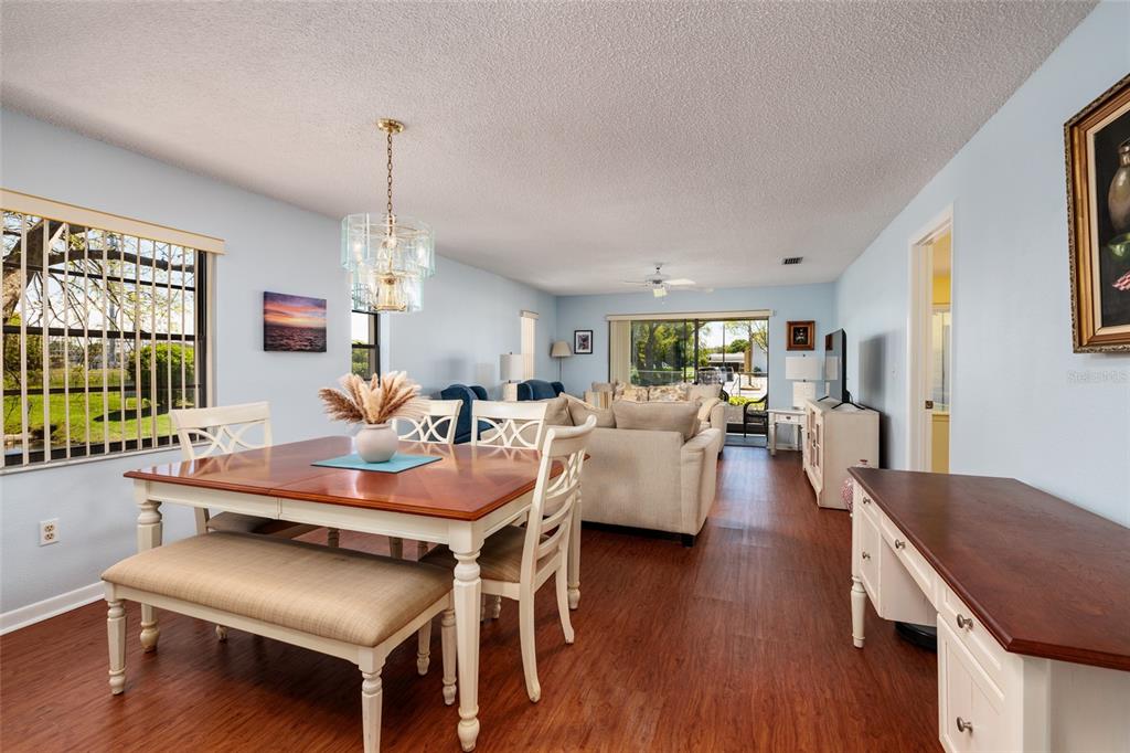 1601 43rd Street, Unit 149 St. Petersburg, FL 33713 - Photo 12 of 51 a living room with furniture a window and wooden floor