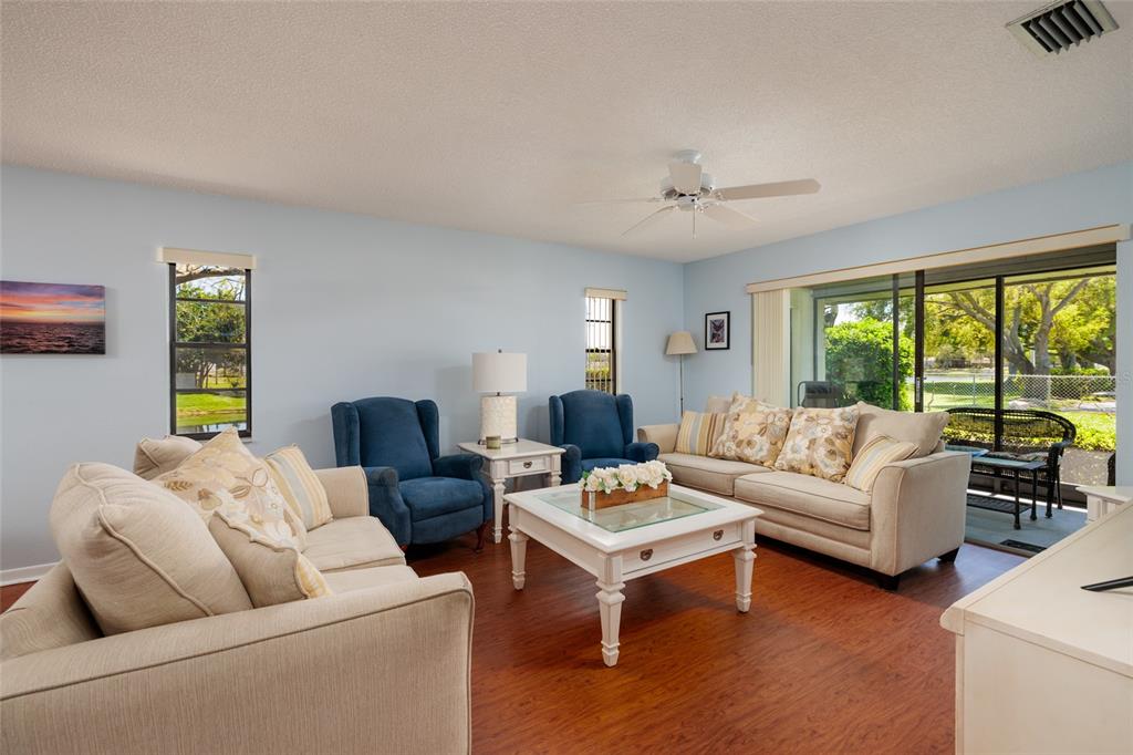 1601 43rd Street, Unit 149 St. Petersburg, FL 33713 - Photo 13 of 51 a living room with furniture and a large window