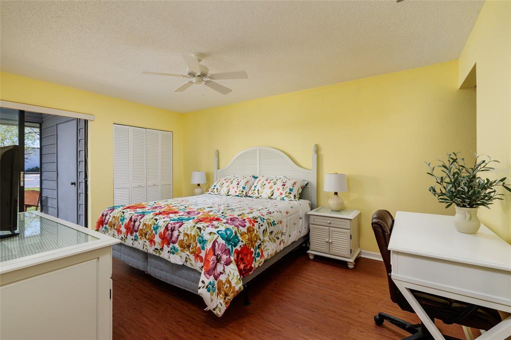 1601 43rd Street, Unit 149 St. Petersburg, FL 33713 - Photo 16 of 51 a bedroom with a bed and a table in it