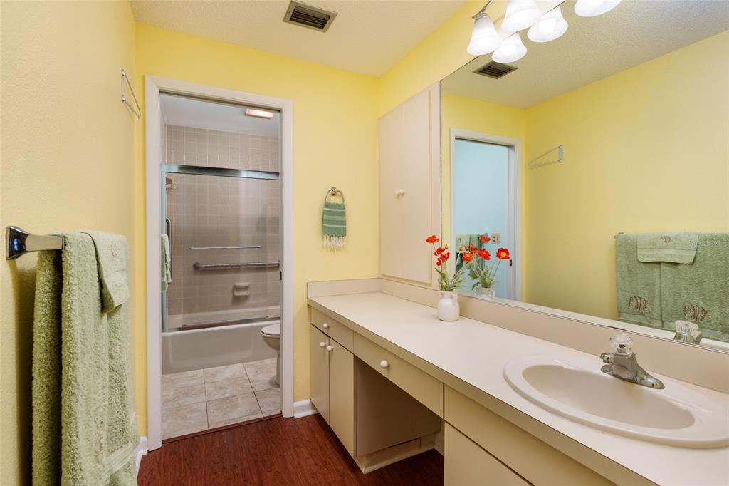1601 43rd Street, Unit 149 St. Petersburg, FL 33713 - Photo 17 of 51 a bathroom with a granite countertop sink and a mirror