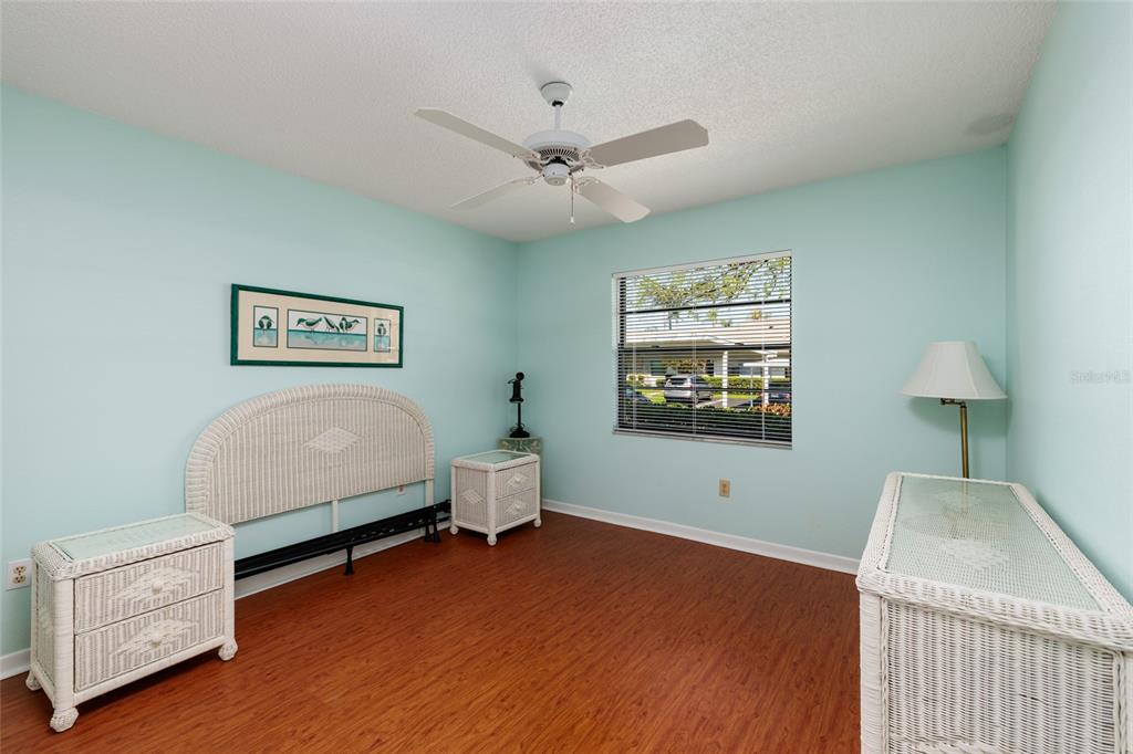 1601 43rd Street, Unit 149 St. Petersburg, FL 33713 - Photo 22 of 51 a bedroom with furniture and a window