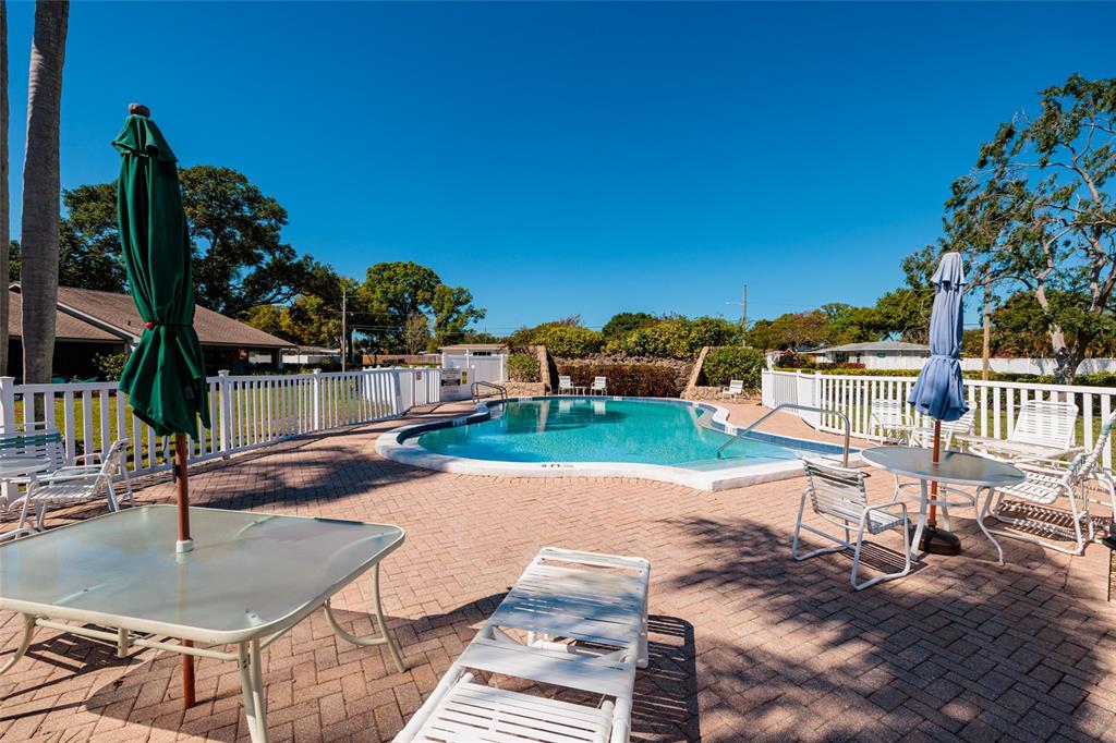 1601 43rd Street, Unit 149 St. Petersburg, FL 33713 - Photo 28 of 51 a view of a house with backyard and sitting area