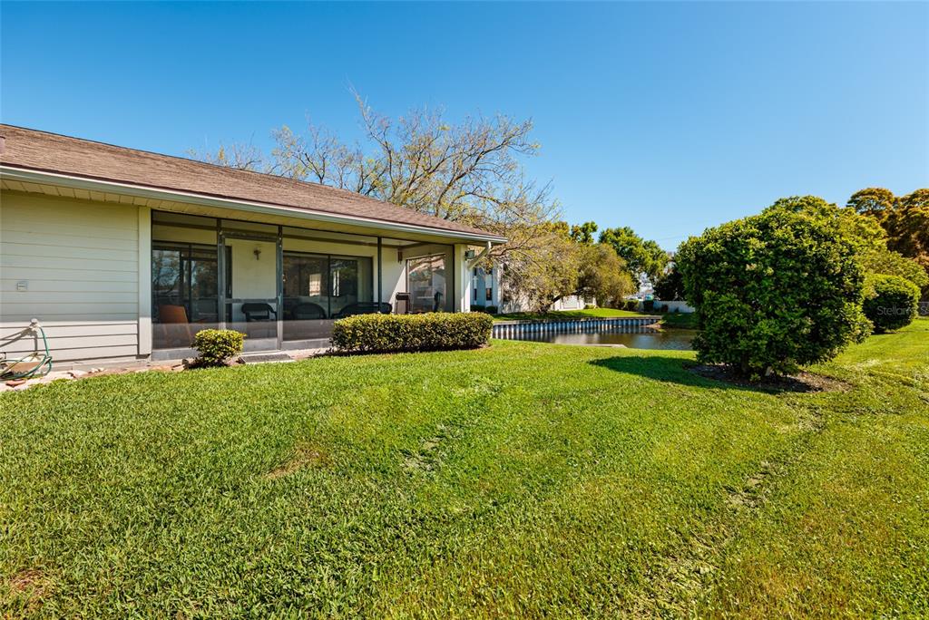 1601 43rd Street, Unit 149 St. Petersburg, FL 33713 - Photo 29 of 51 a view of a house with a backyard