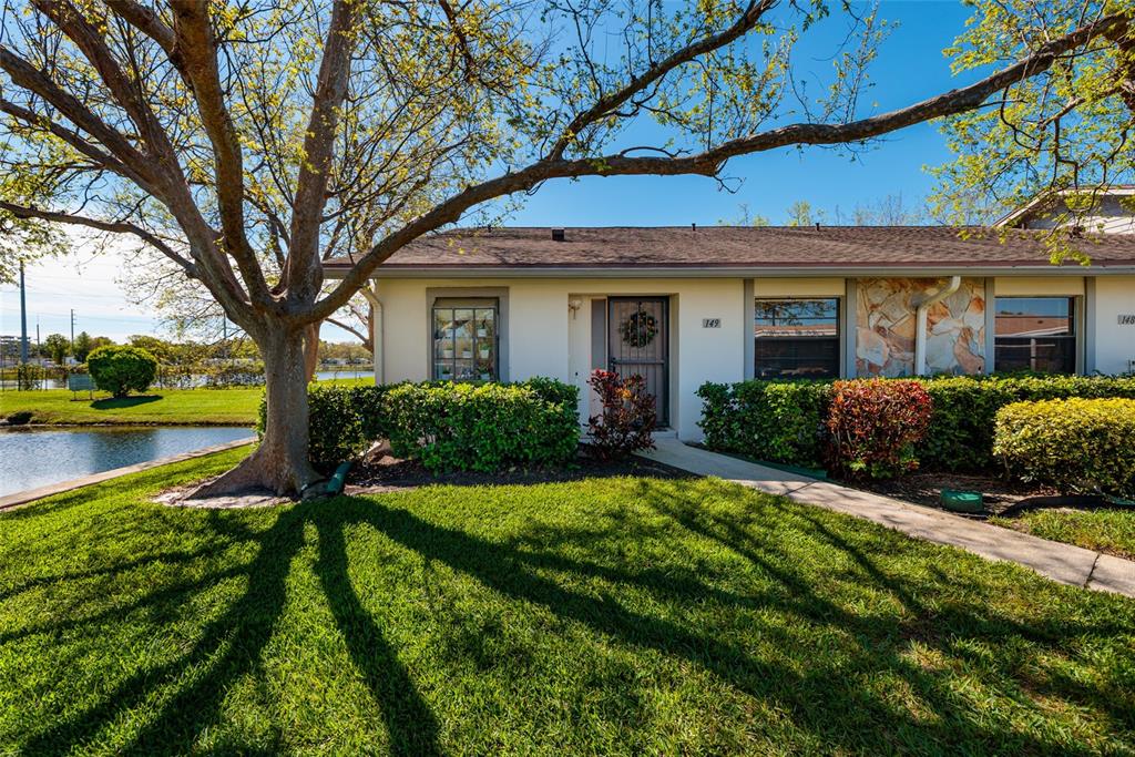 1601 43rd Street, Unit 149 St. Petersburg, FL 33713 - Photo 30 of 51 a front view of a house with a yard