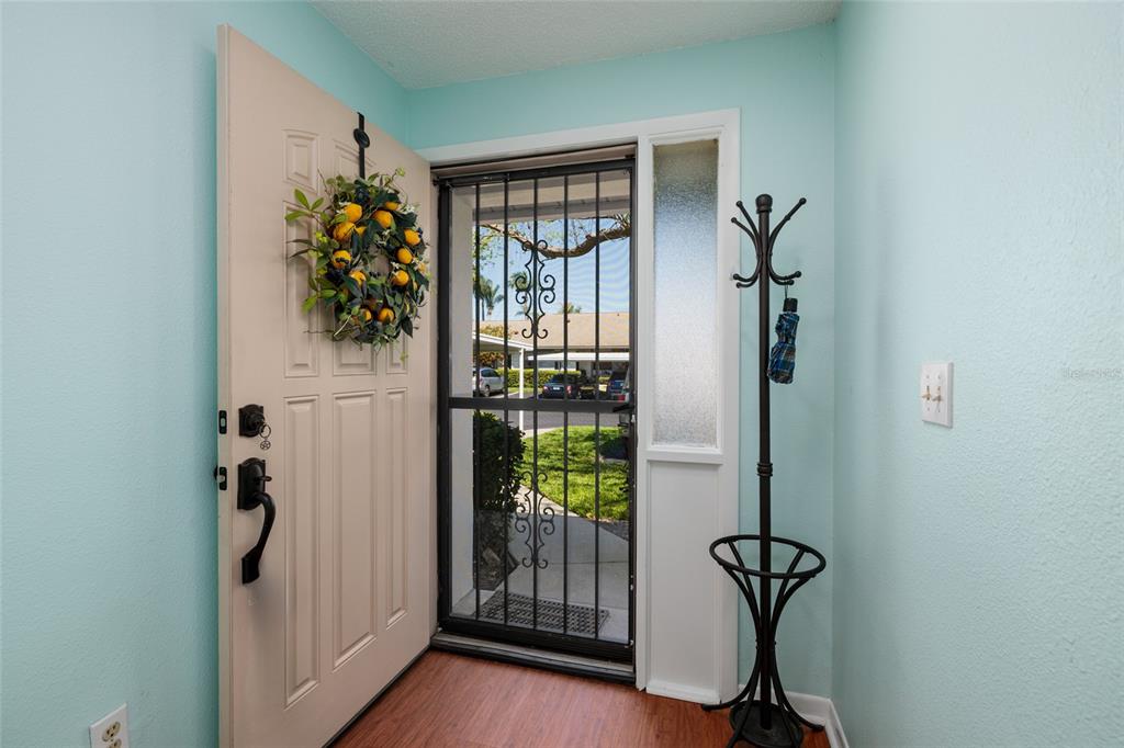 1601 43rd Street, Unit 149 St. Petersburg, FL 33713 - Photo 3 of 51 a view of entryway with wooden floor