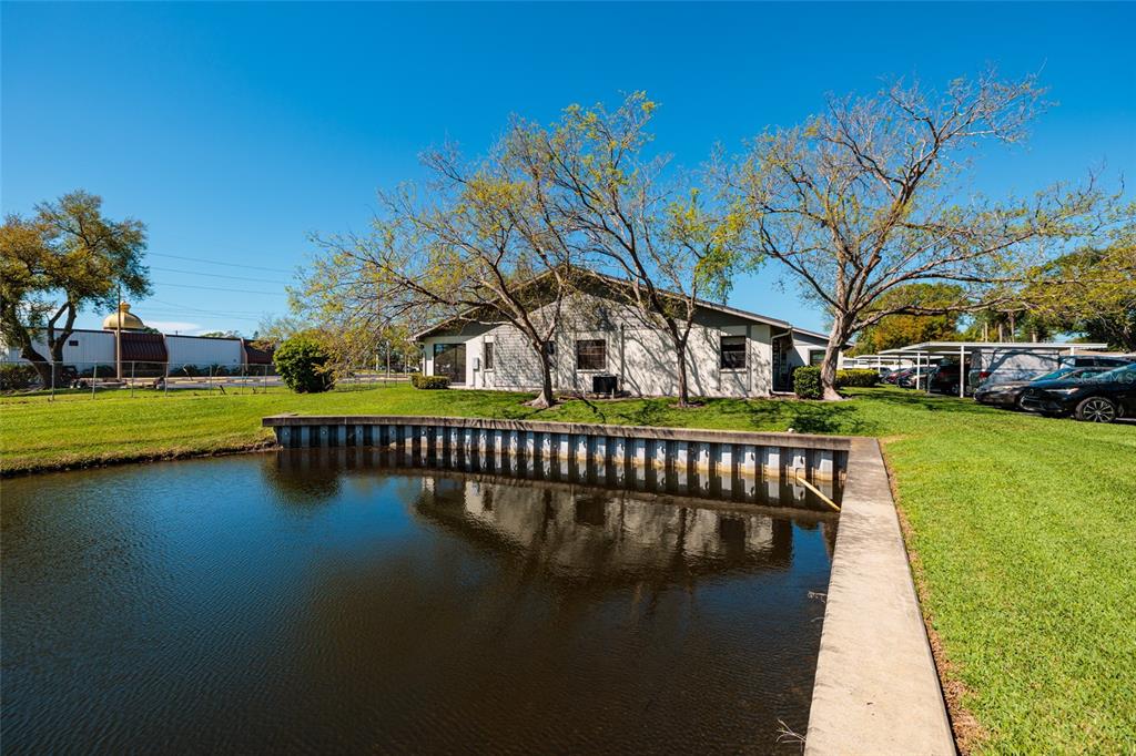 1601 43rd Street, Unit 149 St. Petersburg, FL 33713 - Photo 39 of 51 a view of swimming pool with deck and outdoor seating