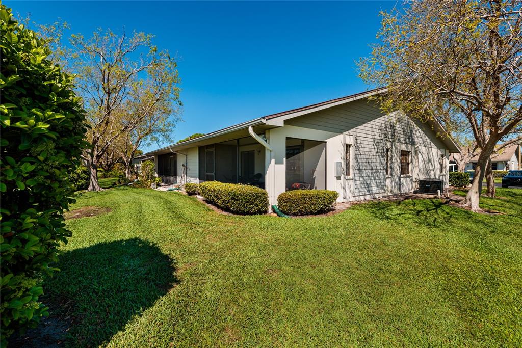 1601 43rd Street, Unit 149 St. Petersburg, FL 33713 - Photo 42 of 51 a front view of house with yard and green space