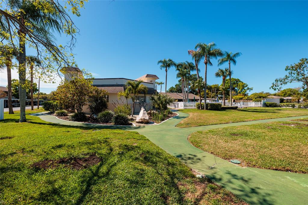 1601 43rd Street, Unit 149 St. Petersburg, FL 33713 - Photo 43 of 51 a view of a house with backyard and sitting area