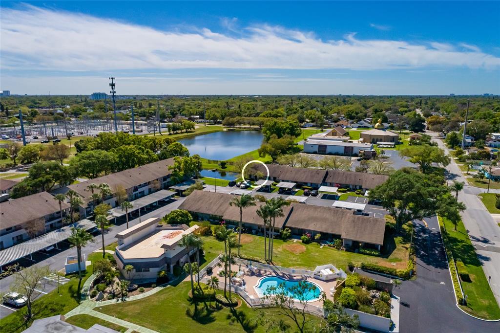 1601 43rd Street, Unit 149 St. Petersburg, FL 33713 - Photo 49 of 51 an aerial view of a house with a swimming pool and outdoor seating