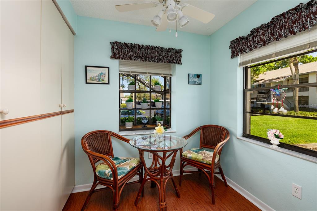 1601 43rd Street, Unit 149 St. Petersburg, FL 33713 - Photo 6 of 51 a view of a dining room with furniture a chandelier and wooden floor