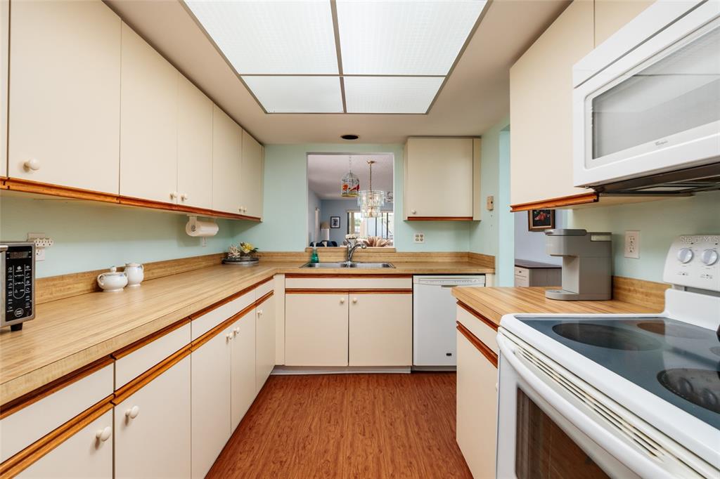 1601 43rd Street, Unit 149 St. Petersburg, FL 33713 - Photo 8 of 51 a kitchen that has a sink and a stove
