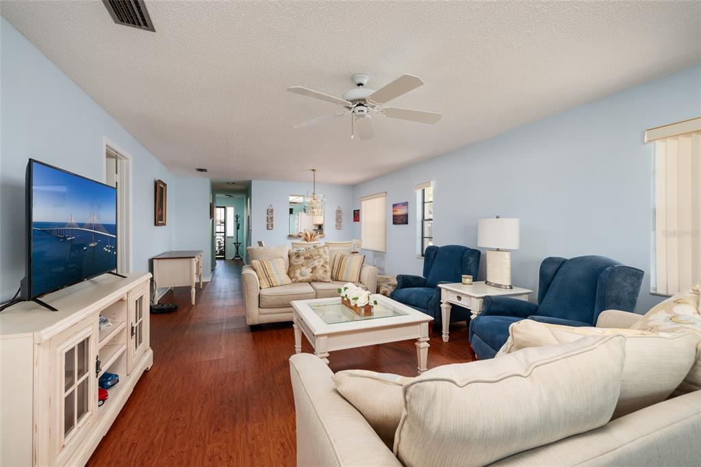 1601 43rd Street, Unit 149 St. Petersburg, FL 33713 - Photo 9 of 51 a living room with furniture and a flat screen tv