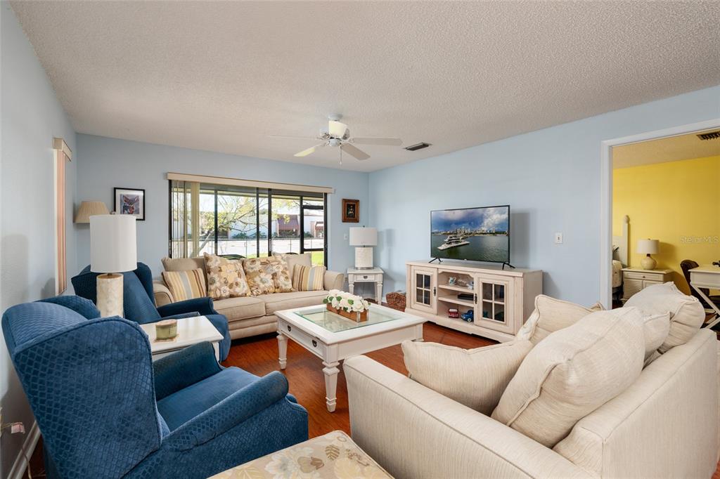 1601 43rd Street, Unit 149 St. Petersburg, FL 33713 - Photo 10 of 51 a living room with furniture and a flat screen tv