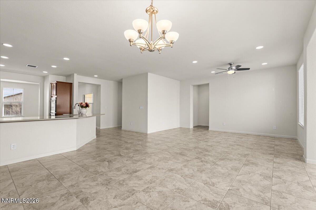 9225 Sassafras Trail Reno, NV 89523 - Photo 11 of 65 a view of a kitchen with a sink and a chandelier