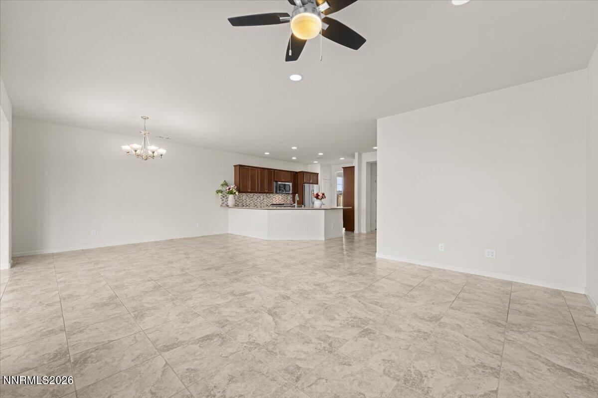 9225 Sassafras Trail Reno, NV 89523 - Photo 14 of 65 a view of a kitchen with a sink and a chandelier fan