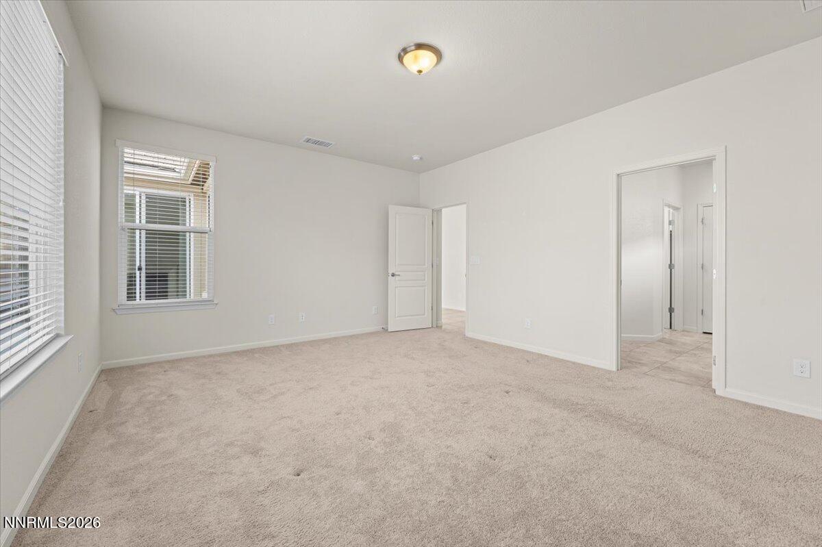9225 Sassafras Trail Reno, NV 89523 - Photo 21 of 65 a view of an empty room with a window