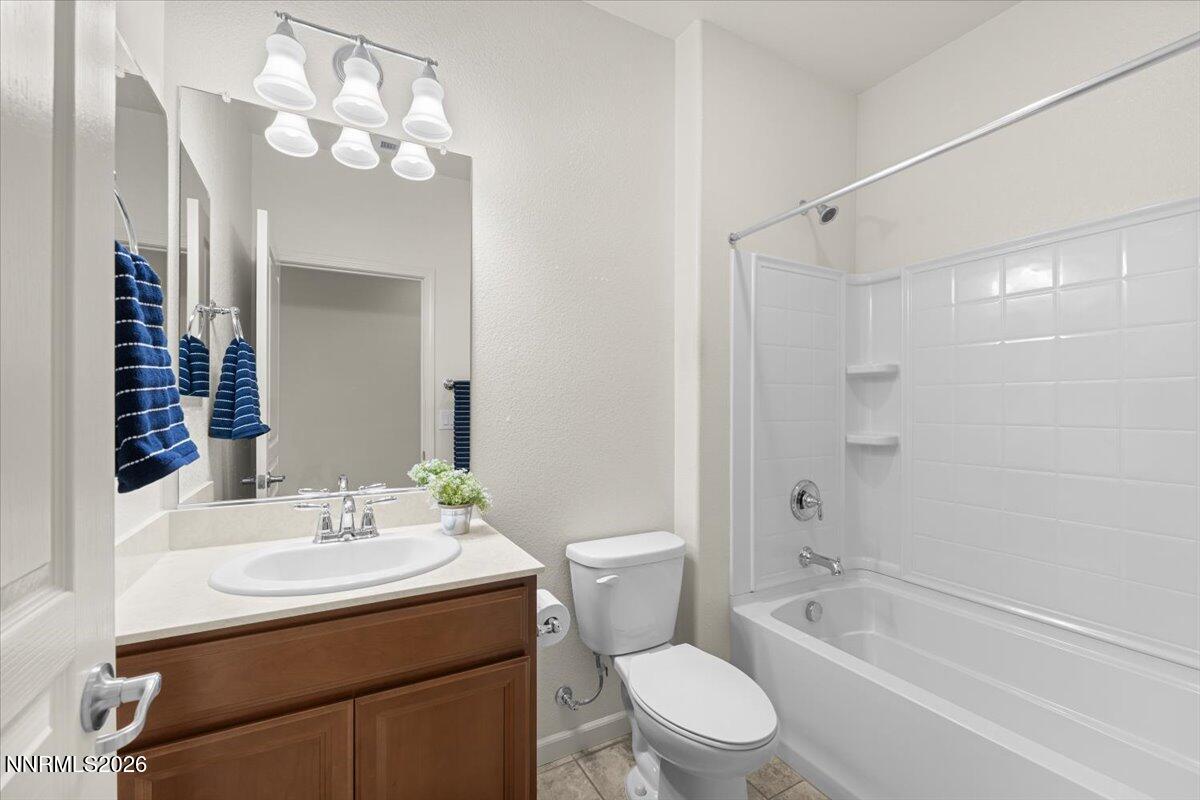 9225 Sassafras Trail Reno, NV 89523 - Photo 28 of 65 a bathroom with a sink toilet tub and shower