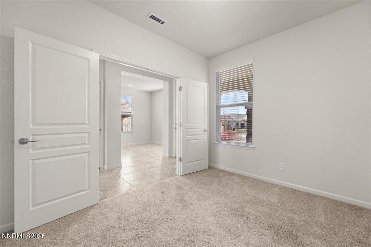 9225 Sassafras Trail Reno, NV 89523 - Photo 30 of 65 an empty room with windows and closet