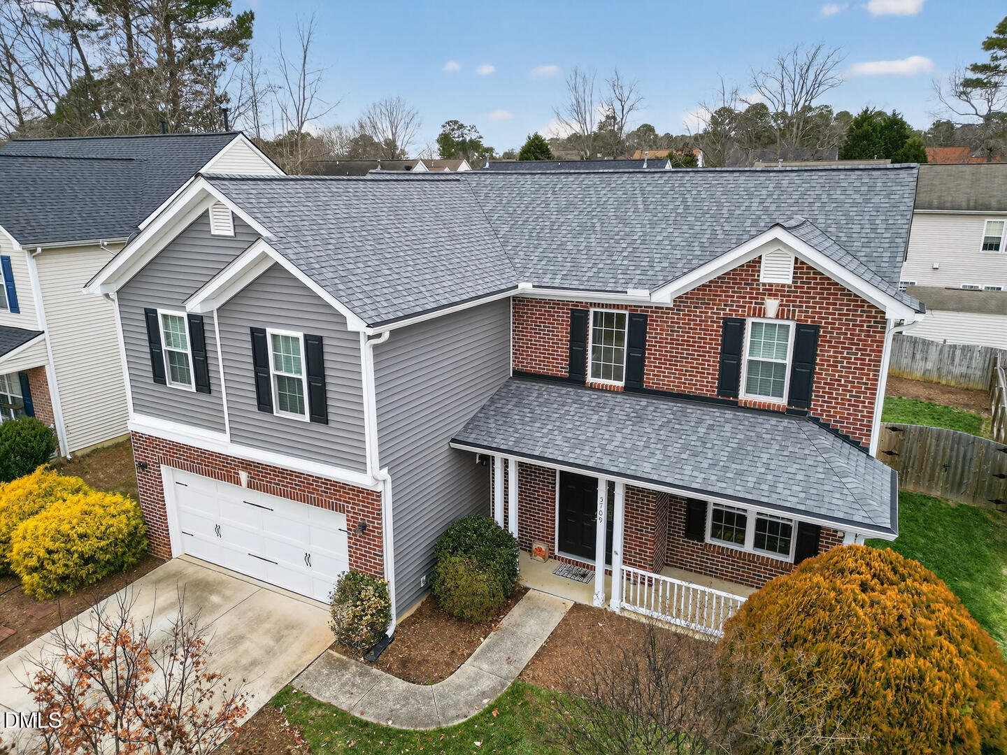 a aerial view of a house with a yard