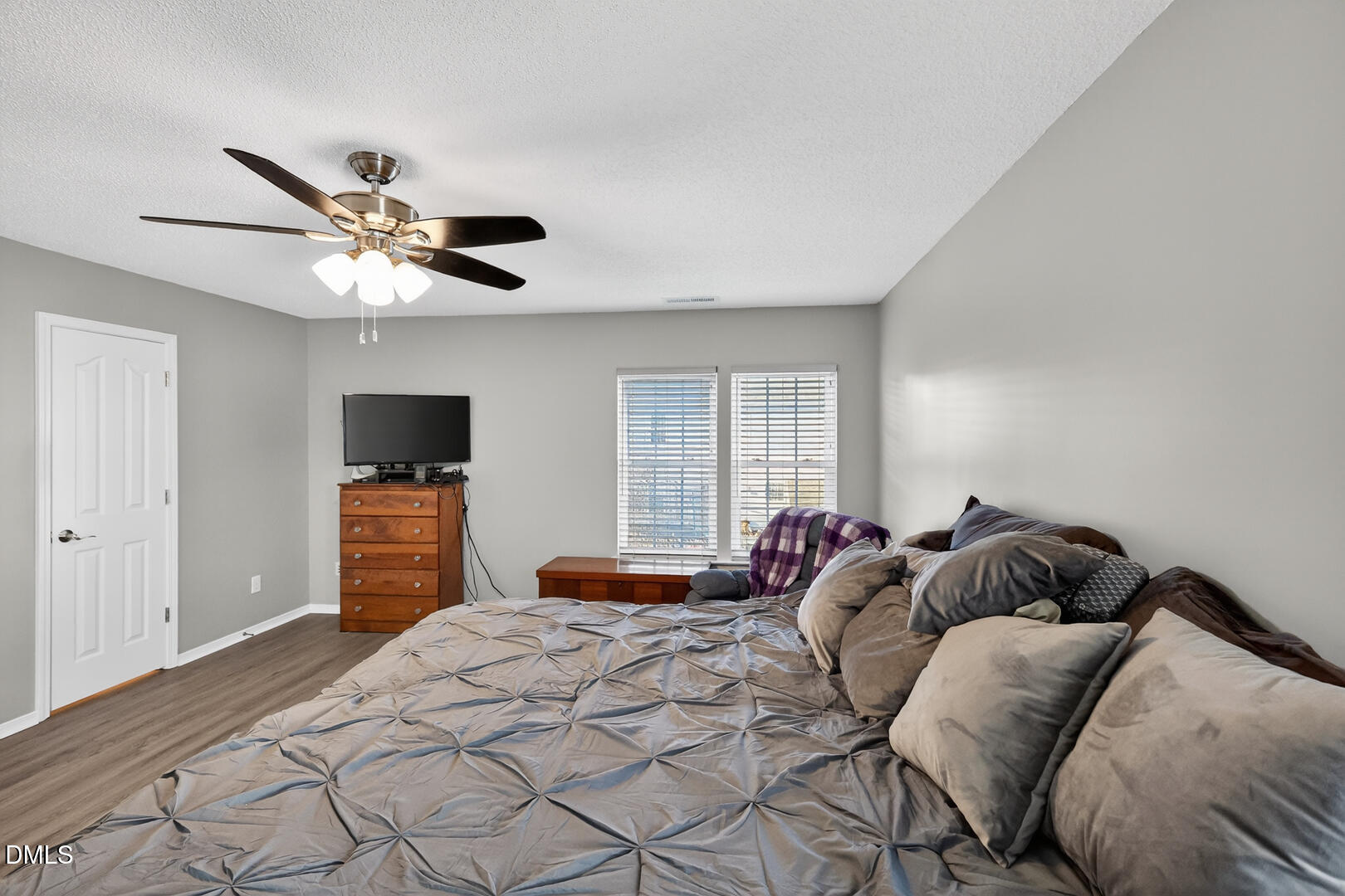 5709 Apalachicula Drive Raleigh, NC 27616 - Photo 15 of 47 a bedroom with a bed and a tv
