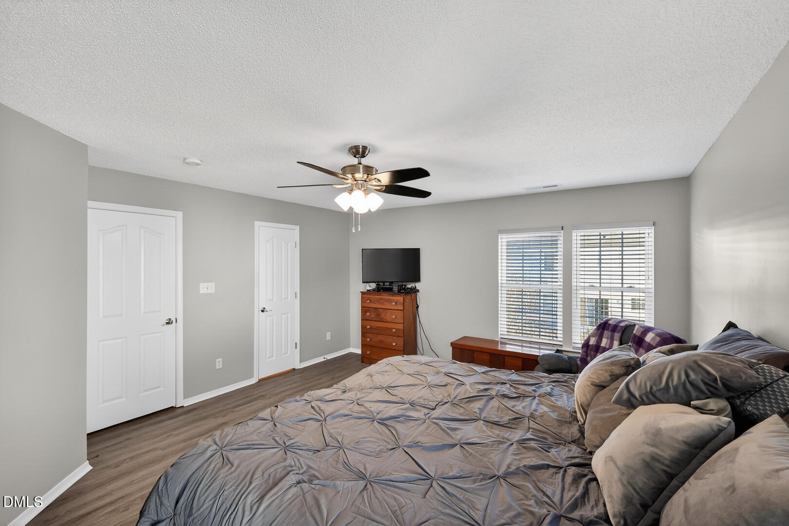 5709 Apalachicula Drive Raleigh, NC 27616 - Photo 16 of 47 a bedroom with a bed and a chandelier