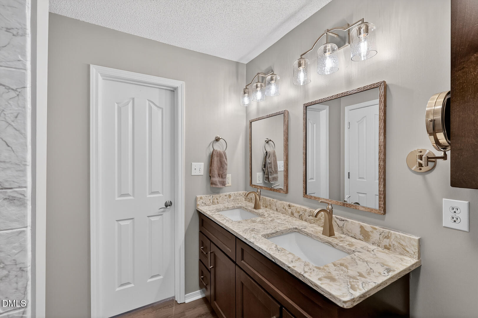 5709 Apalachicula Drive Raleigh, NC 27616 - Photo 19 of 47 a bathroom with a granite countertop sink and a mirror