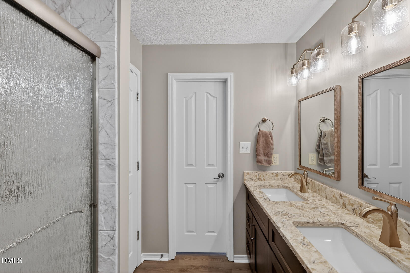 5709 Apalachicula Drive Raleigh, NC 27616 - Photo 21 of 47 a bathroom with a granite countertop double vanity sink and a mirror