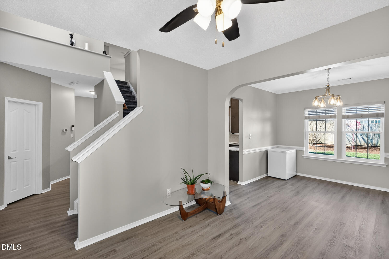 5709 Apalachicula Drive Raleigh, NC 27616 - Photo 23 of 47 a view of an empty room with wooden floor and a window