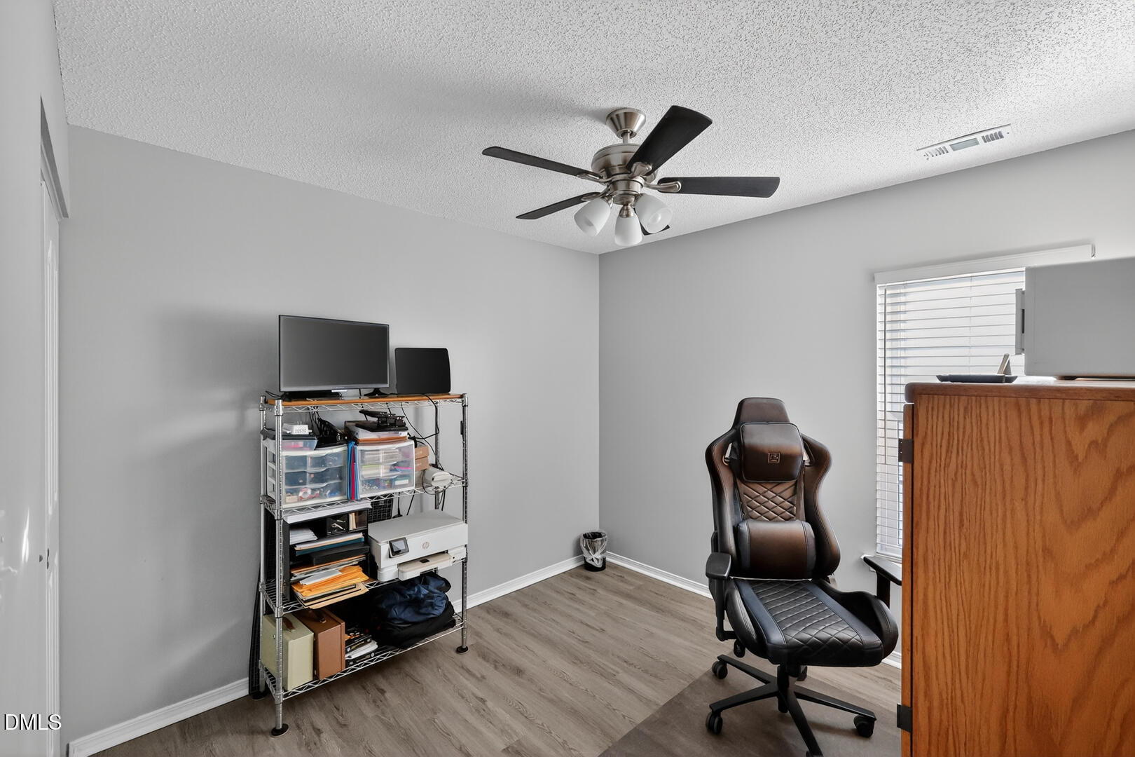 5709 Apalachicula Drive Raleigh, NC 27616 - Photo 29 of 47 a living room with furniture and a flat screen tv