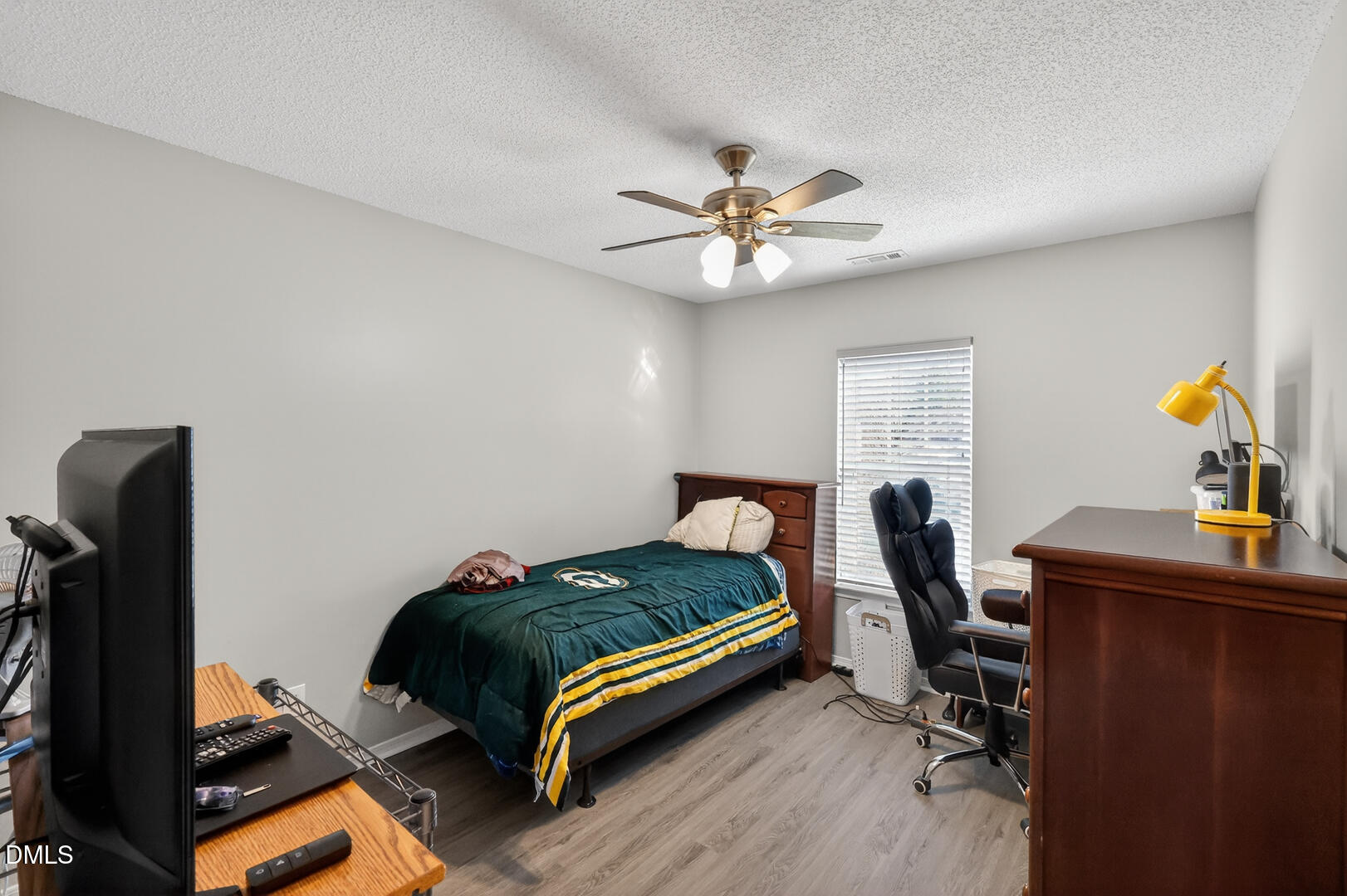 5709 Apalachicula Drive Raleigh, NC 27616 - Photo 30 of 47 a bedroom with furniture and a window