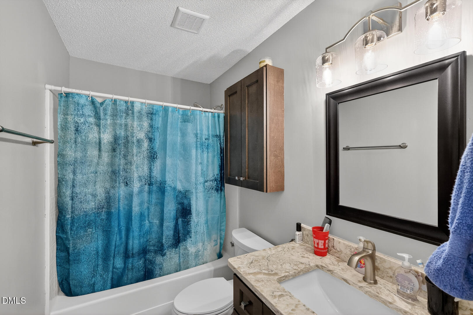 5709 Apalachicula Drive Raleigh, NC 27616 - Photo 33 of 47 a bathroom with a sink and a mirror