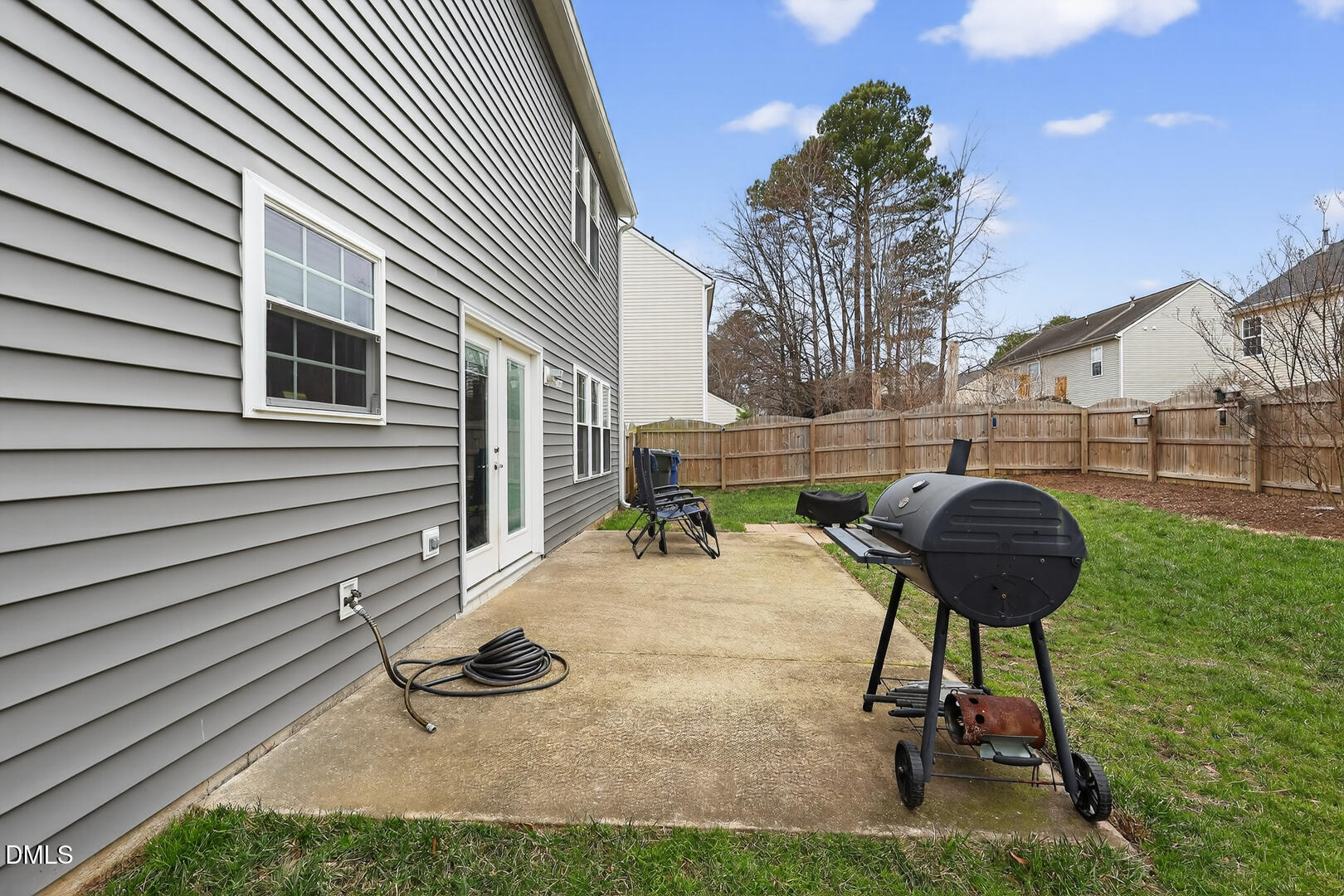 5709 Apalachicula Drive Raleigh, NC 27616 - Photo 44 of 47 a backyard of a house with table and chairs