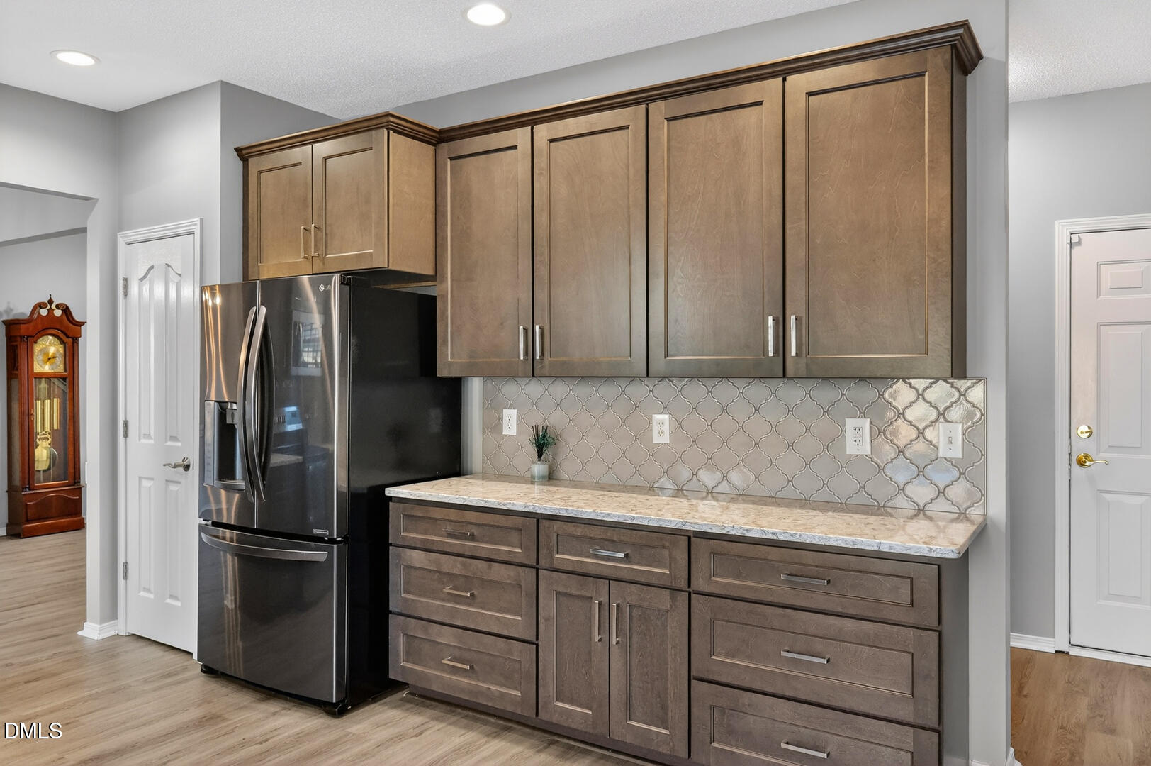 5709 Apalachicula Drive Raleigh, NC 27616 - Photo 9 of 47 a kitchen with stainless steel appliances granite countertop a refrigerator and cabinets