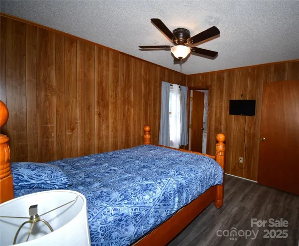 a bedroom with a bed and dresser