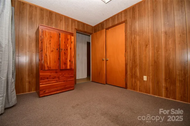 a view of an empty room with stairs