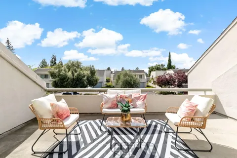 a view of a chairs and table in the terrace