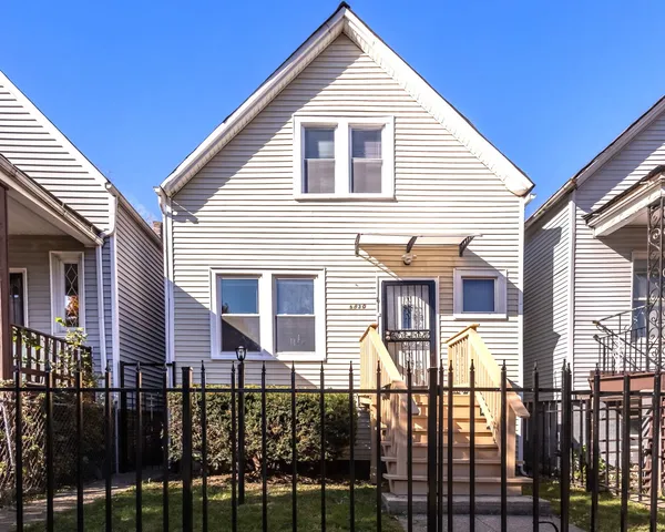 a front view of a house with glass windows