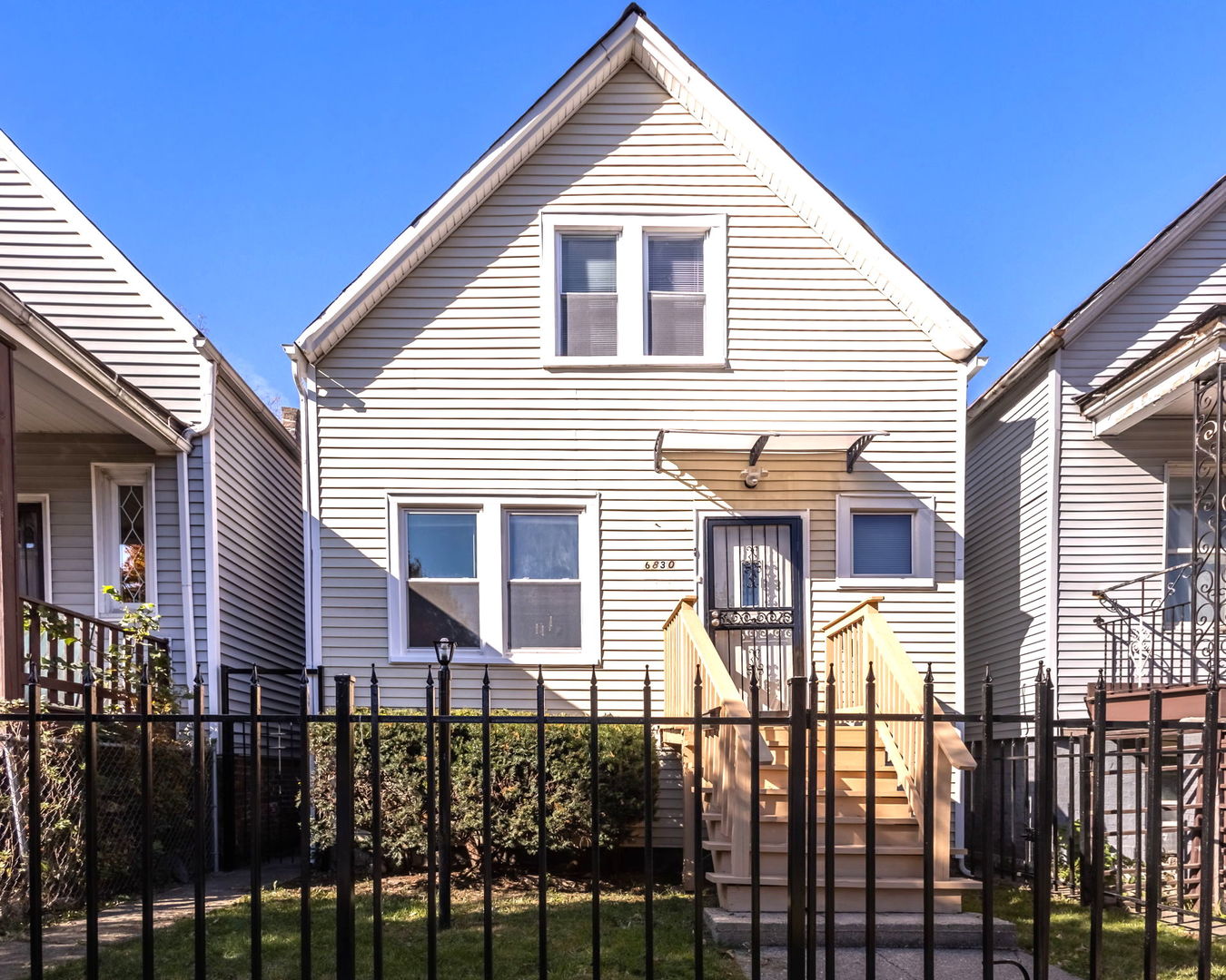 a front view of a house with glass windows