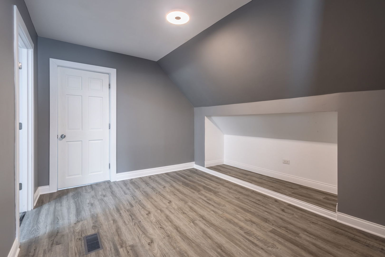 6830 South Honore Street Chicago, IL 60636 - Photo 14 of 31 a view of an empty room with wooden floor