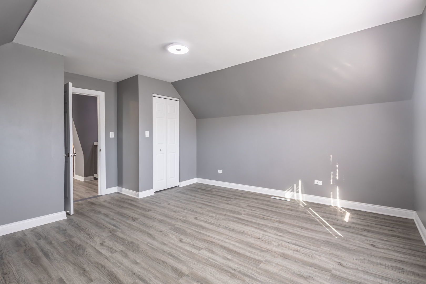 6830 South Honore Street Chicago, IL 60636 - Photo 18 of 31 a view of an empty room with wooden floor