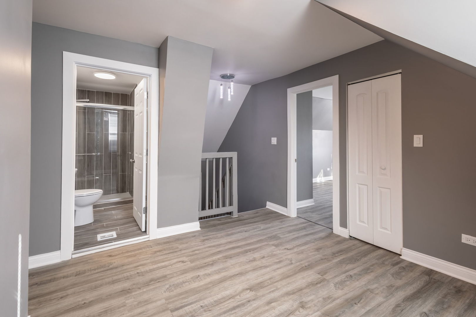 6830 South Honore Street Chicago, IL 60636 - Photo 20 of 31 a view of a hallway with wooden floor and a bathroom